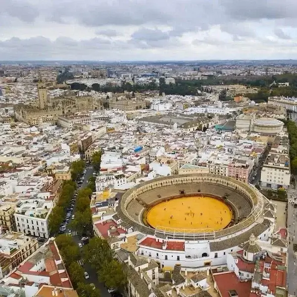 An aerial view of the Plaza de Toros and the cathedral in the background