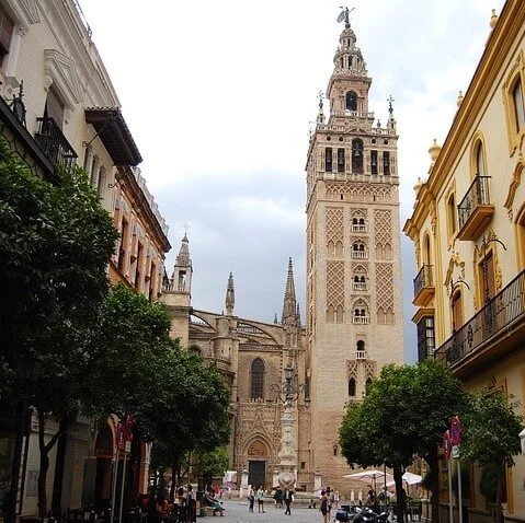 View through a street towards the Giralda Bell Tower 