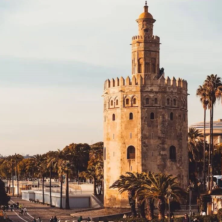 The Gold Tower and people walking