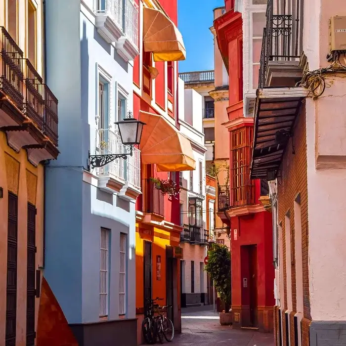 Colourful Sevillian buildings down a street